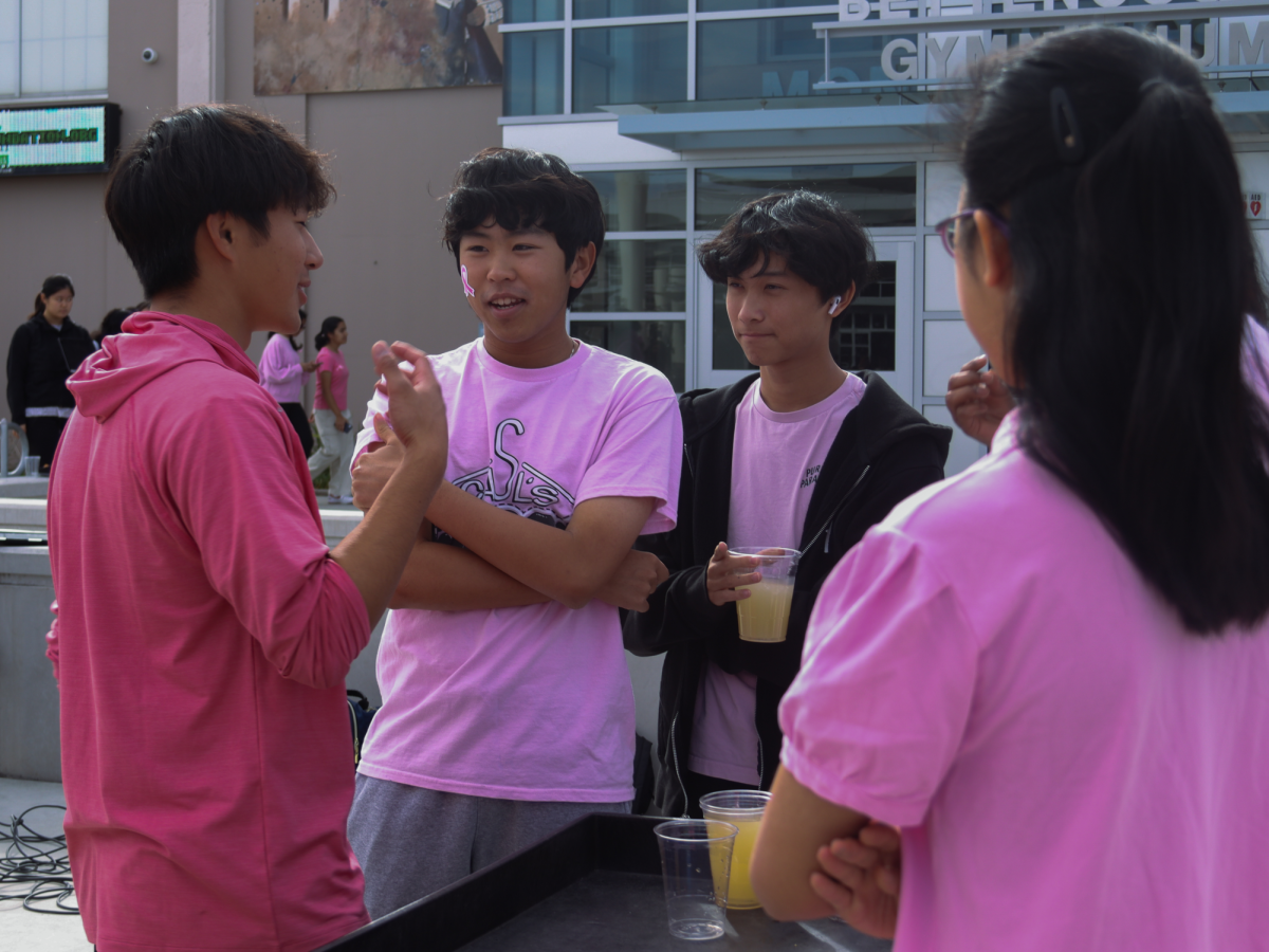 Students wear pink to show support for breast cancer awareness while enjoying lemonade handed out by ASB Leadership.