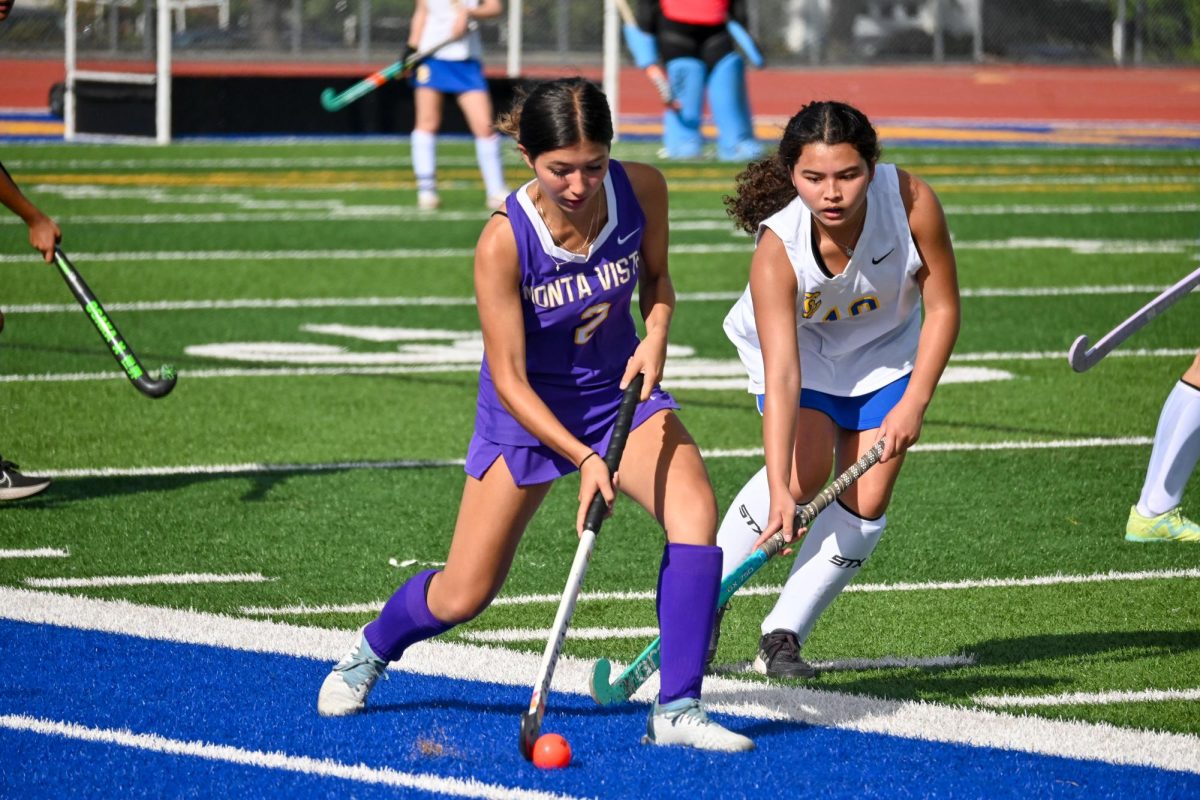 Senior Lilia Murase (left) maneuvers the ball past a defender in a game against Santa Clara High School, losing 9-1 on Monday, Sept. 16. Photo by Kaia Yuan