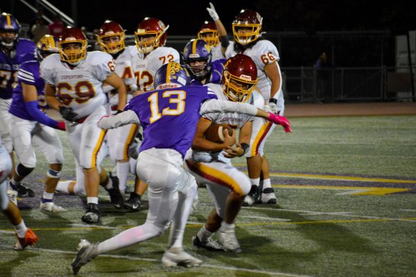 Junior and safety Vishal Iyer attempts to tackle a CHS player in the 2023-2024 Helmet Game.