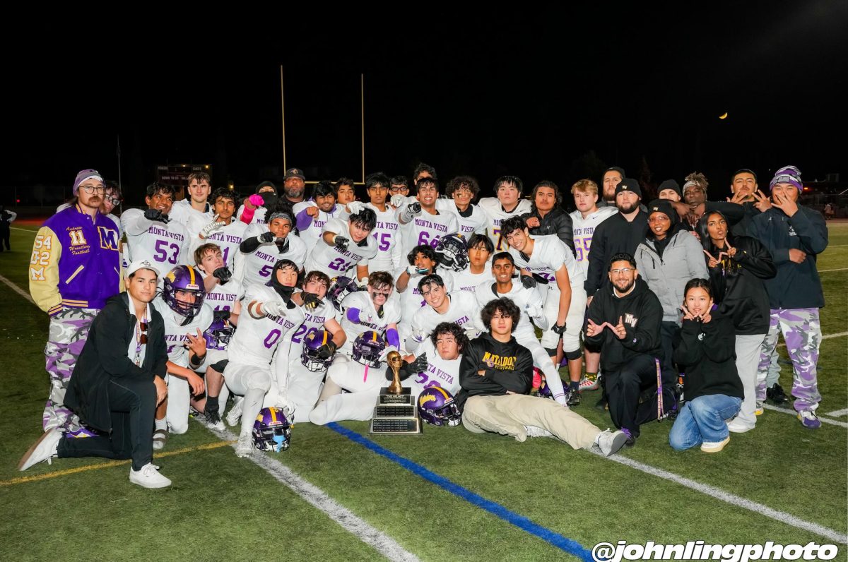 MVHS Football team and staff pose for a picture after defeating Cupertino High School in the Helmet Game