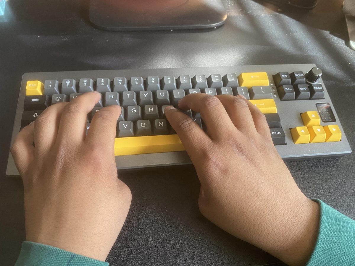 Junior Shivasharan Chaganti typing on his self-modded keyboard