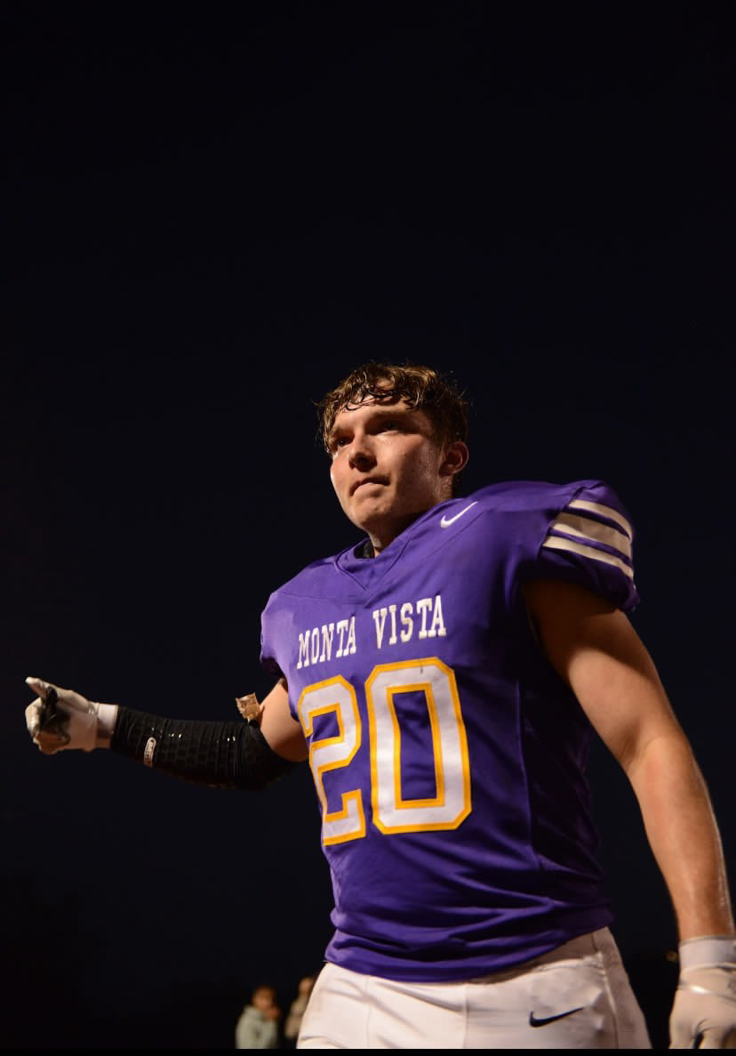 Running back Finnegan Hassy walks off the field after an offensive play 