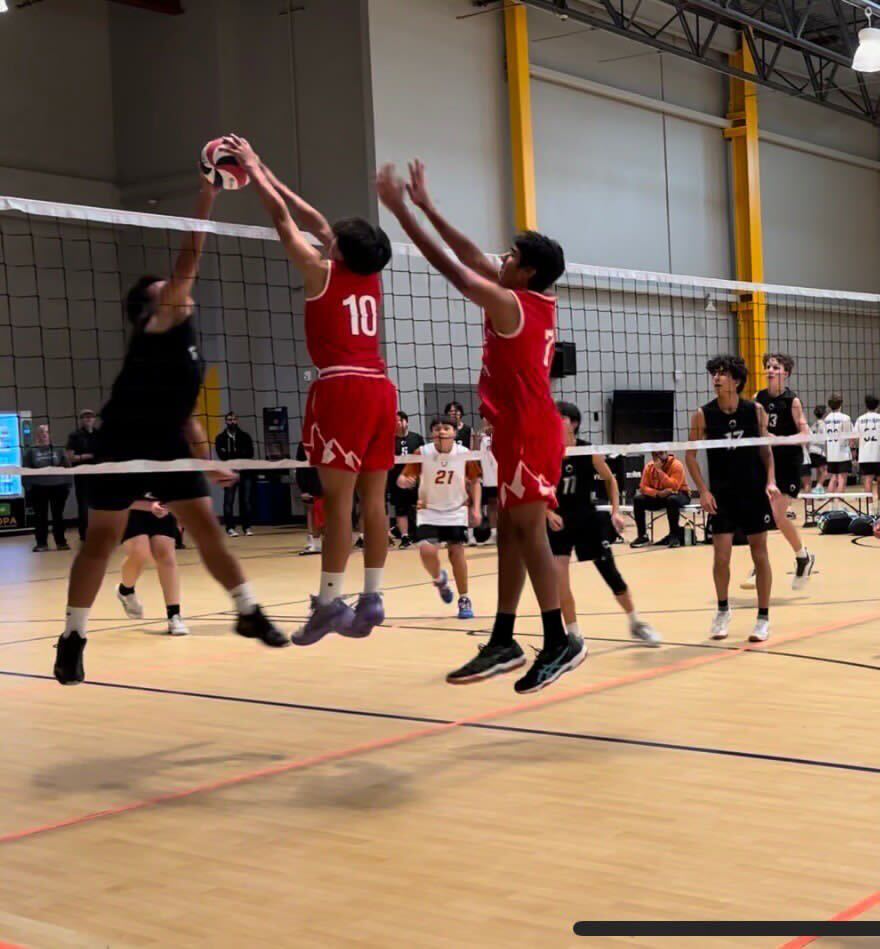 Freshman Finn Ancheta jumps to hit the volleyball. Photo courtesy of Kennedy Ancheta | Used with permission