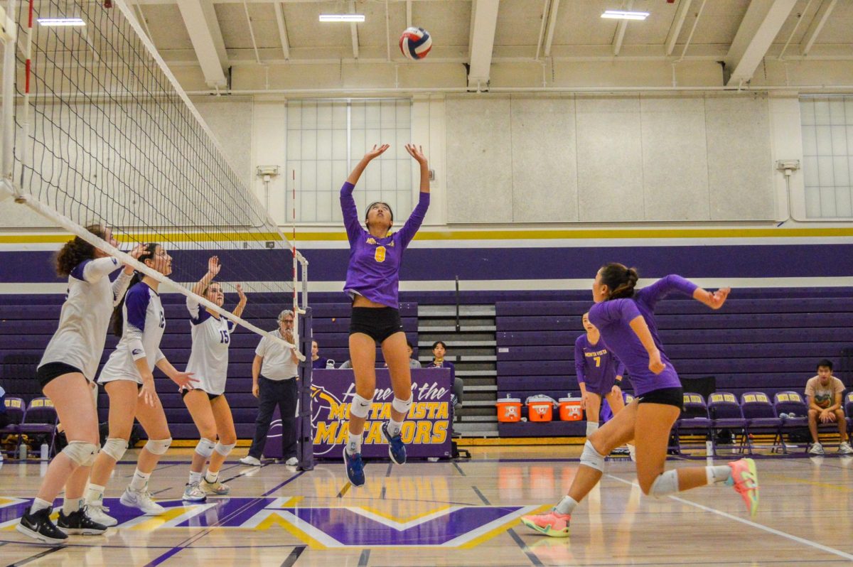 Sophomore Kylee Mark sets the ball during a game against Sequoia High School on October 20, 2023. Photo | Manas Kottakota