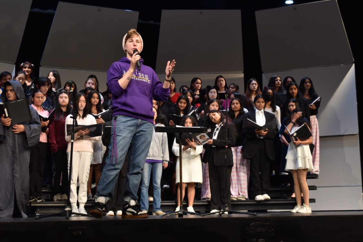 Choir teacher Lofn Young speaks at last year's spring concert. Photo | Sophia D'Sa