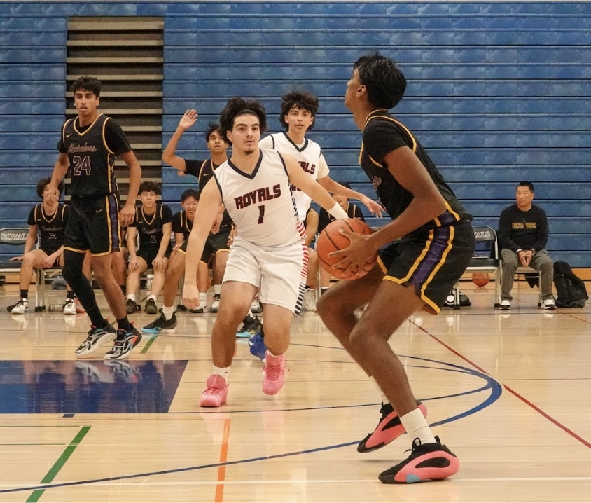 Senior Ninad Suresh prepares to shoot as an opponent attempts to block. 