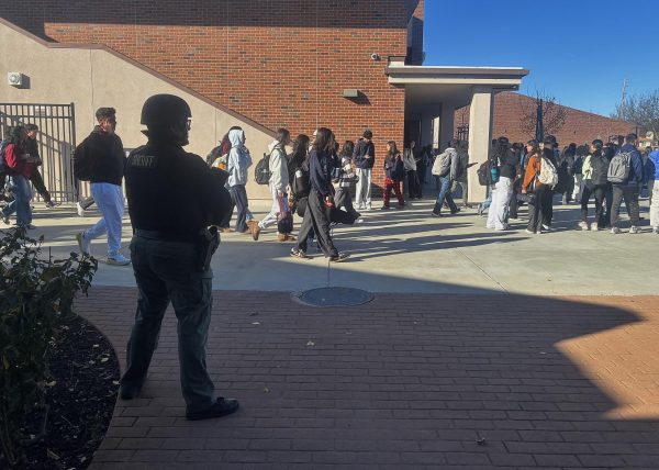 Sheriffs monitor students as they are released from school following administration’s all-clear. Photo | Kathryn Foo