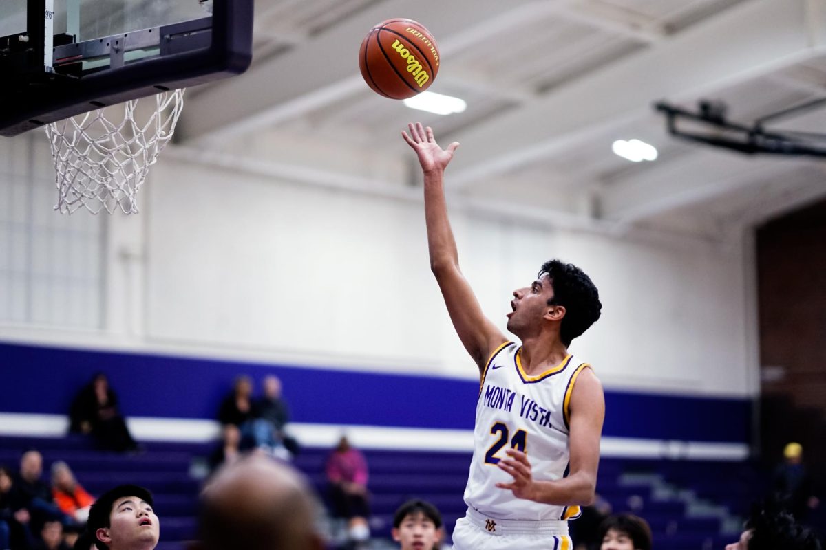 Senior and small forward Parth Upadhayay scores a layup.

Photo | Ethan Yang