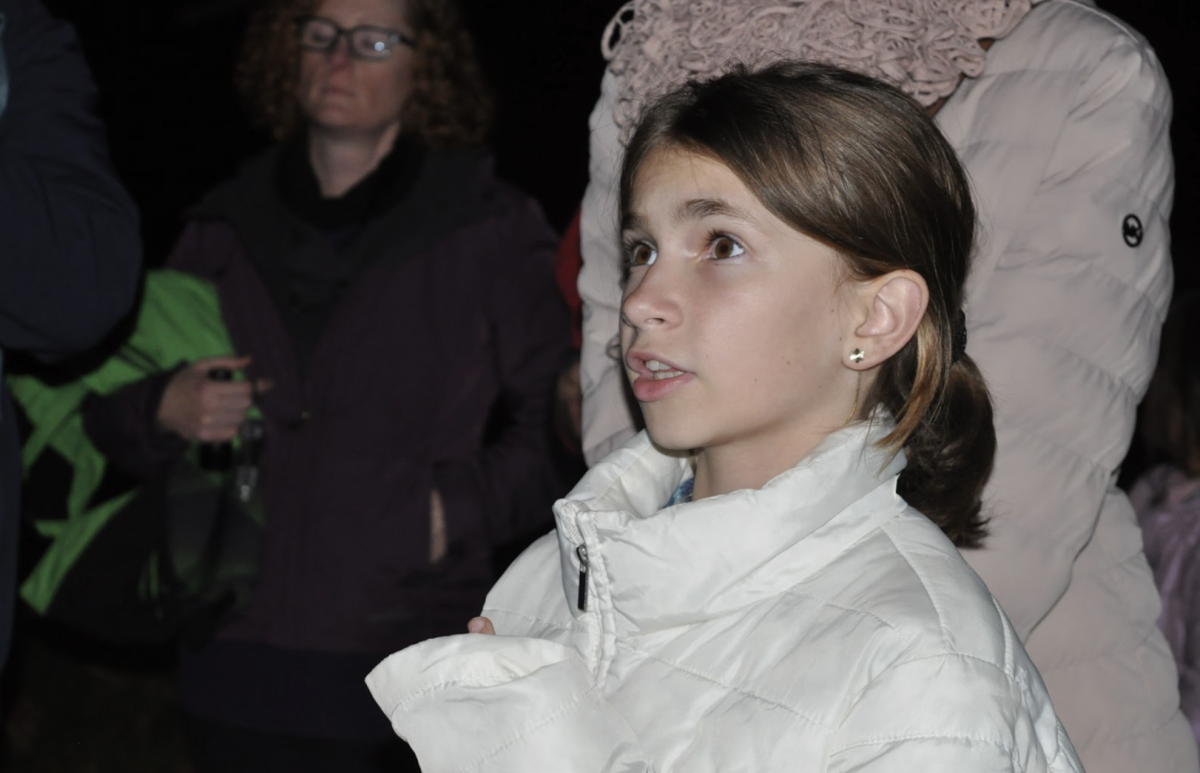 A child attending the Night Hike answers the park ranger’s questions regarding the animals in McClellan Ranch Preserve. Photo | Kate Yang