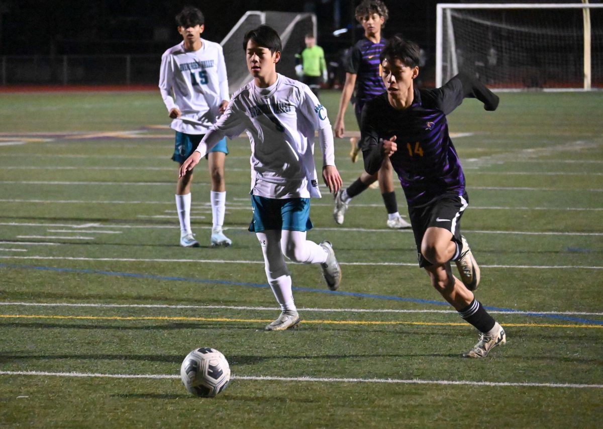 Senior Connor Kwan drives the ball down the field.
