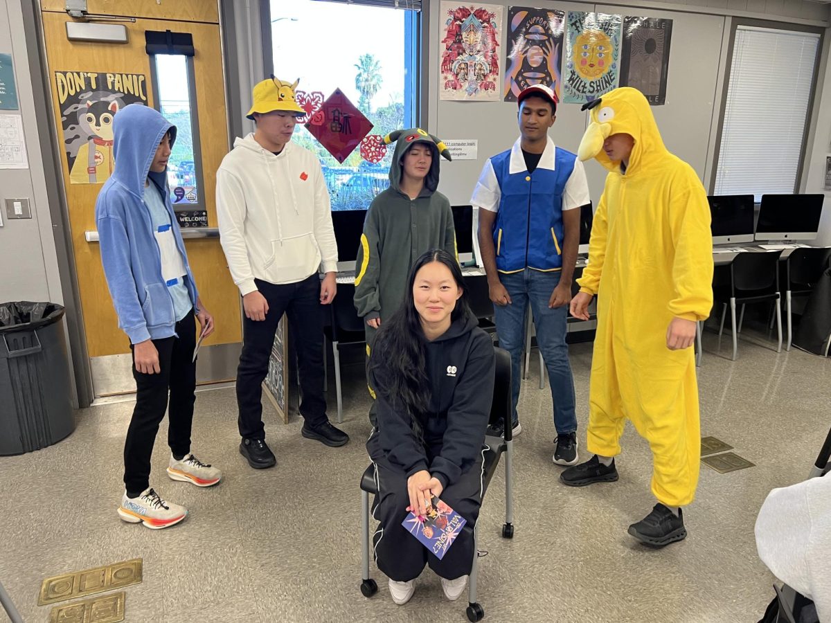 A group of Pokemon themed singers prepare their performance dedicated to senior Alyssa Yang.
