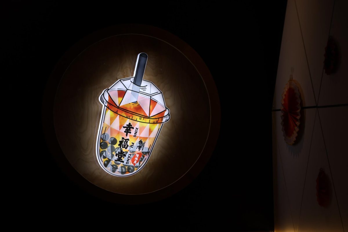 A decorative light in the shape of the popular brown sugar boba milk hangs on the wall of Xing Fu Tang’s walk-in. Photo | Benjamin Zhang