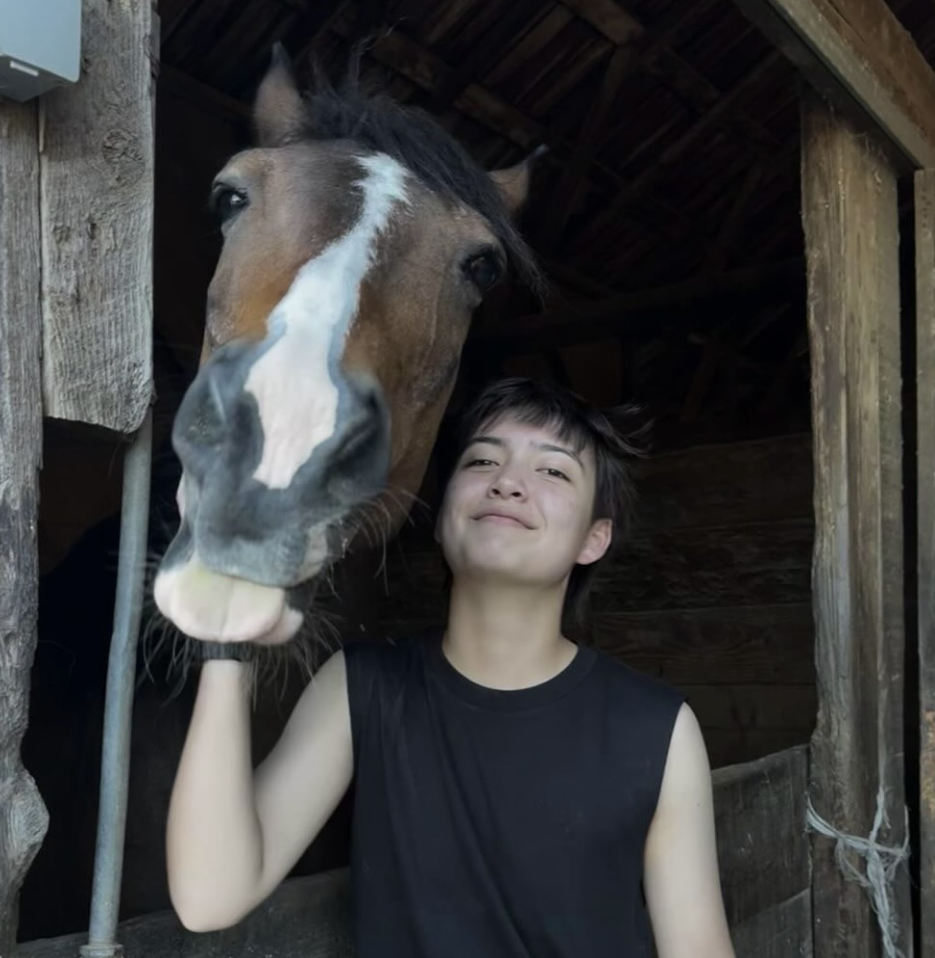 Junior Ozzy Christian poses with his horse. Photo courtesy of Ozzy Christian | Used with permission