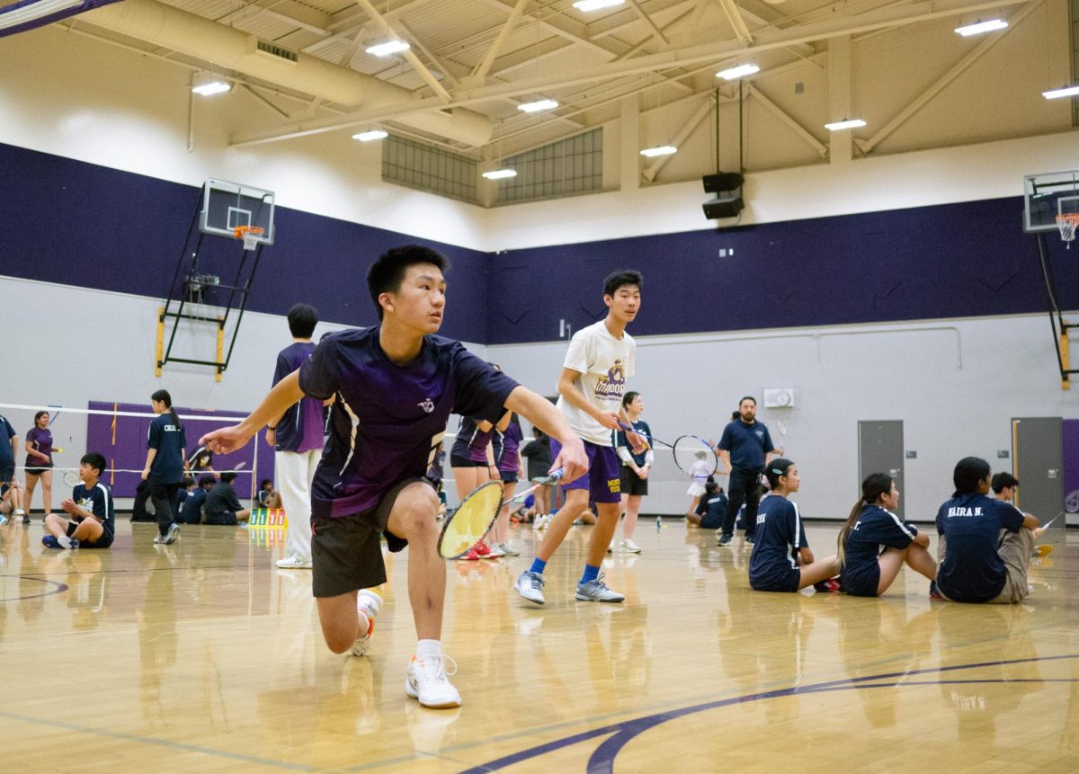 Sophomore and boys doubles player Jeremy Li lunges to hit the birdie.  Photo | Vaishnavi Katukam 