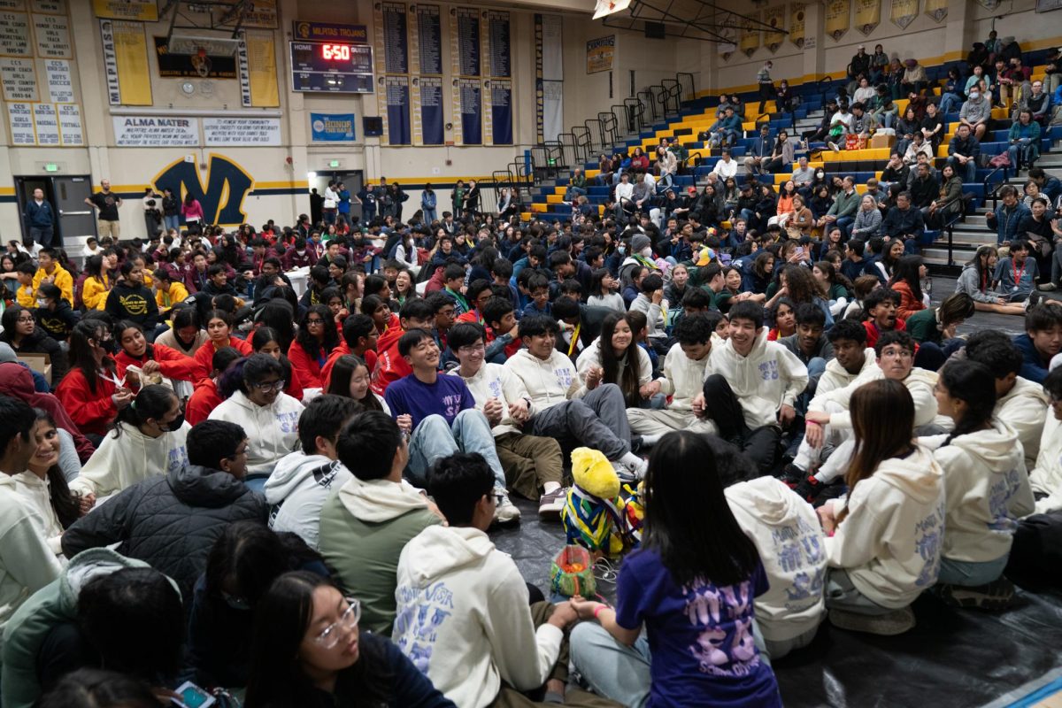 MVHS Science Olympiad prays to the 
"Science Olympiad gods" before the competition results are announced. Photo courtesy of Maya Pullara | Used with permission