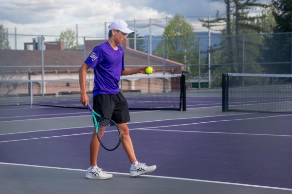 Freshman and singles player Kevin Chen prepares to serve. Photo | Kaia Yuan
