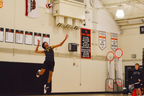 Freshman and outside hitter Ayan Deshpande serves the ball.

Photo by Manas Kottakota
