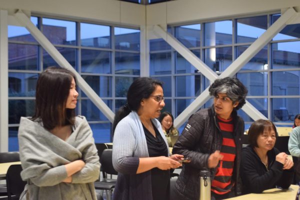 Parents discuss at the PTSA meeting in the Student Union