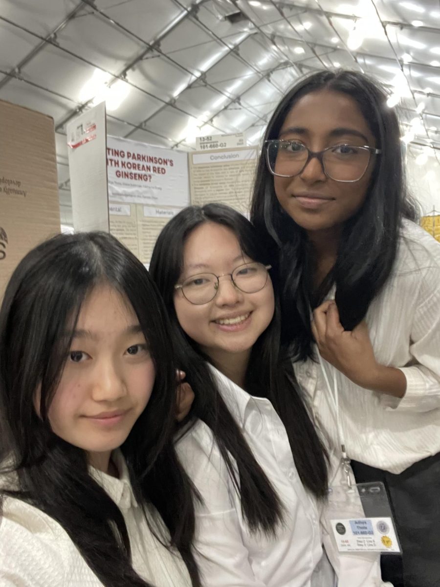Sophomores Catherine Zhang, Subin Lee and Adhya Thota take a selfie in front of their project before Synopsys presentations. Photo courtesy of Catherine Zhang | Used with permission