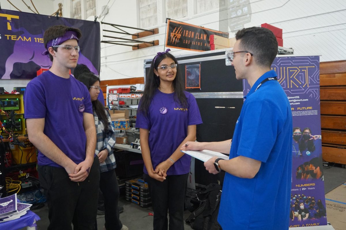 Senior Dylan Cangoglu and sophomore Tanya Bandodkar present the MVHS Robotics team’s robot and answer questions from a judge during Pinnacles. Photo courtesy of Anna Zhang | Used with permission