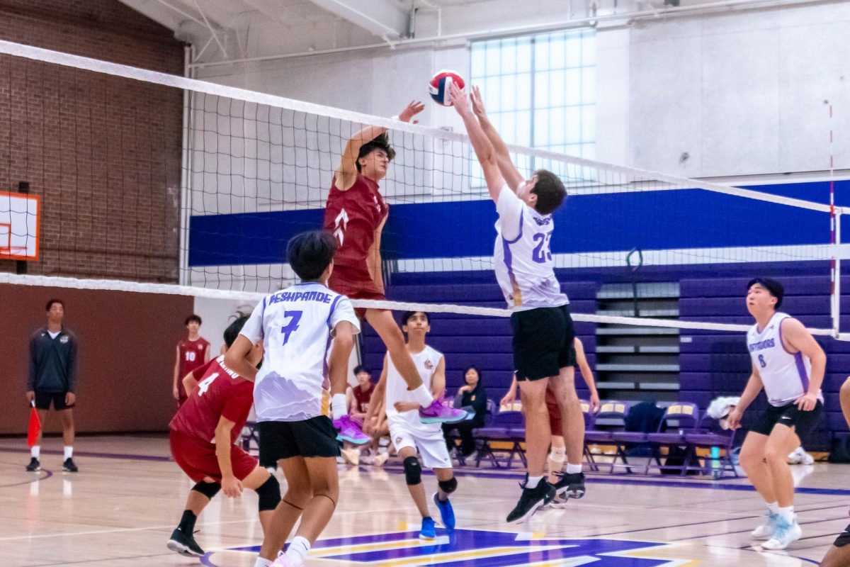 Junior and middle hitter Joaquin Garcia blocks a tip from CHS. 