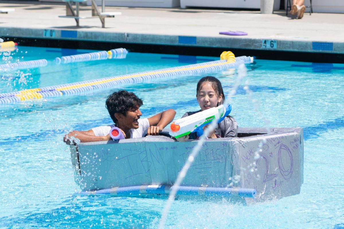 Students face off in the MVHS pool on self-constructed boats