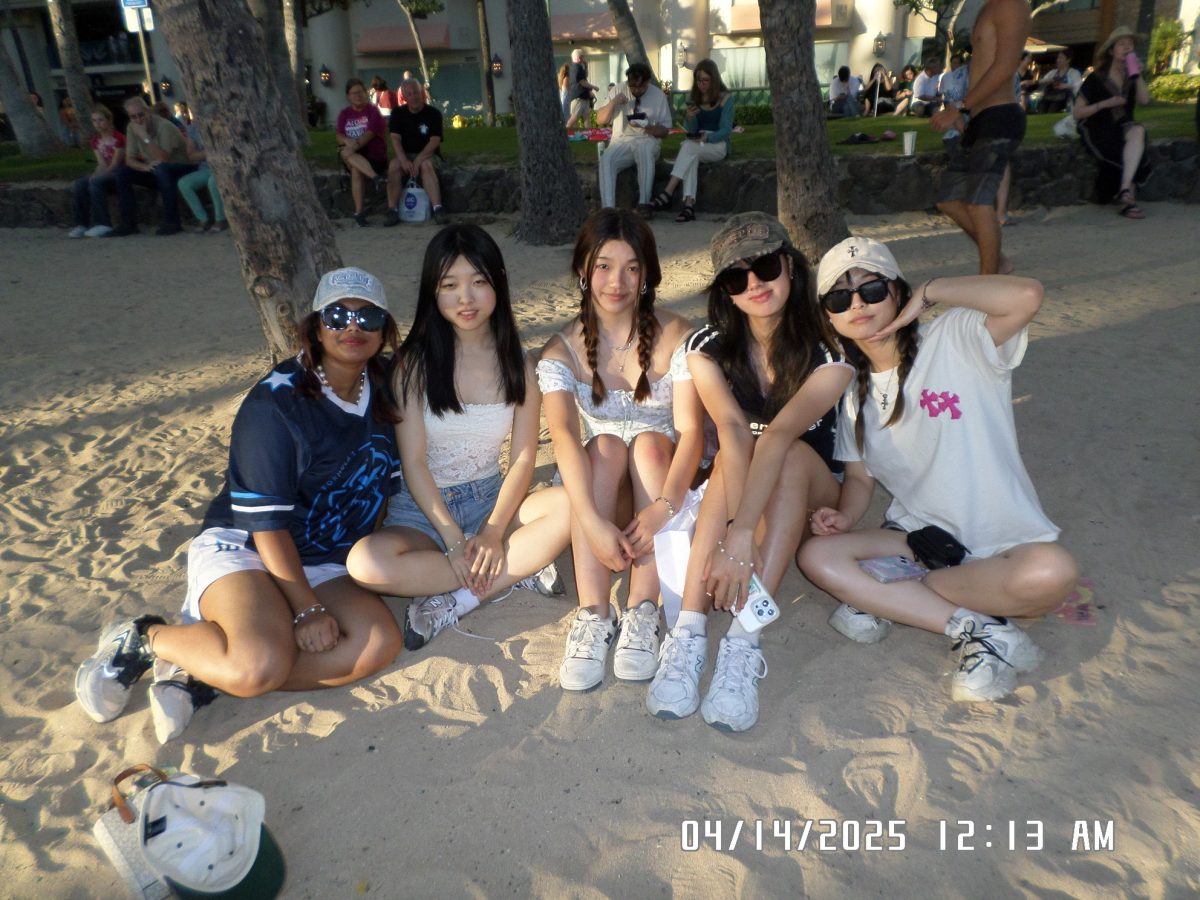 Senior Jessica Zhou poses with her friends on a beach in Honolulu, Hawaii. Photo courtesy of Jessica Zhou | Used with permission.