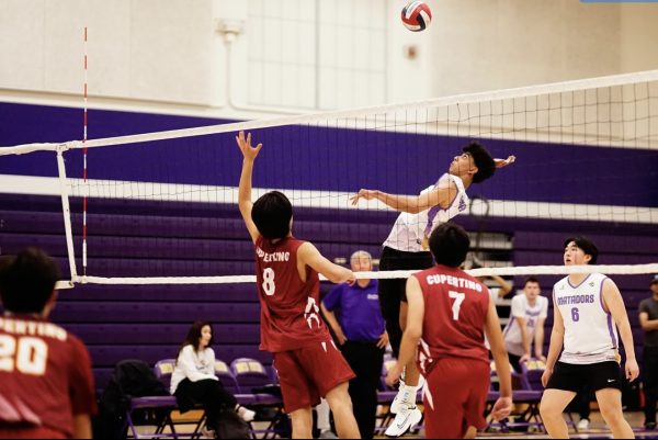Junior and middle blocker Pratham Kannan jumps up to hit the ball over the net. Photo | Ethan Yang 