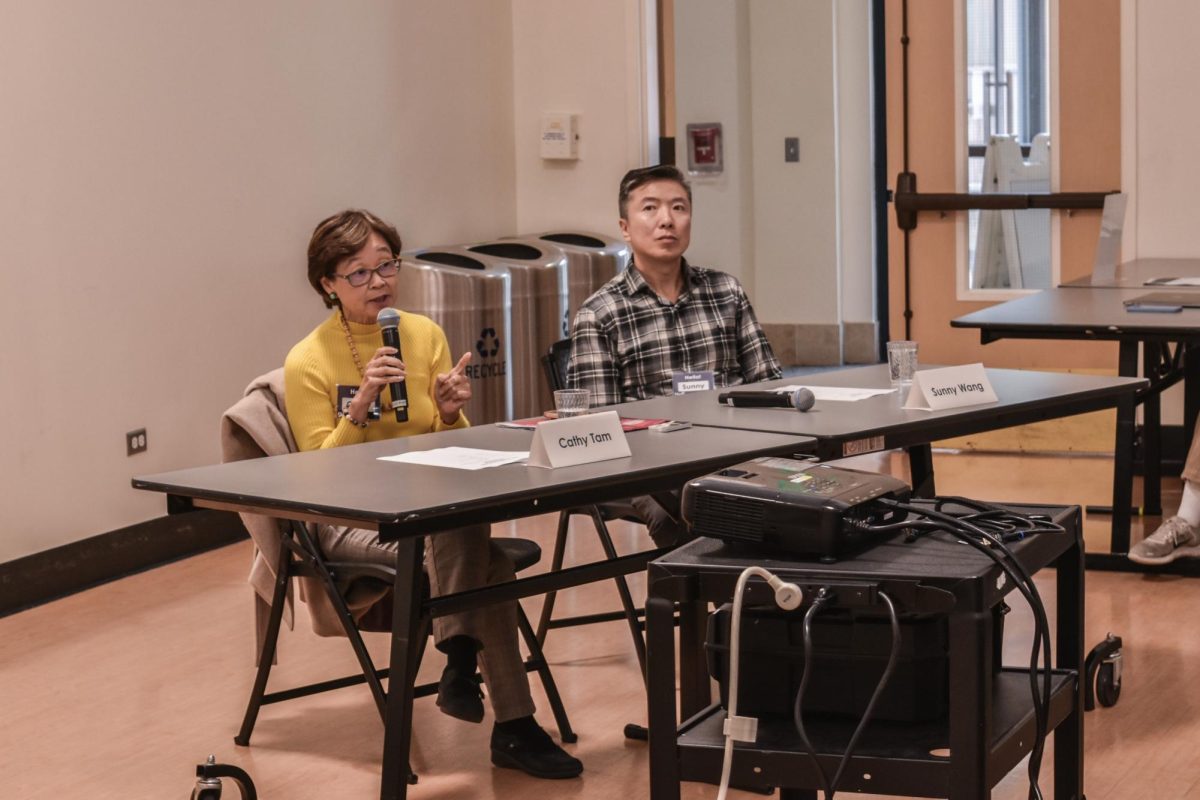 Tam addresses an audience question regarding Individual Retirement Arrangements. Photo | Jonah Chang