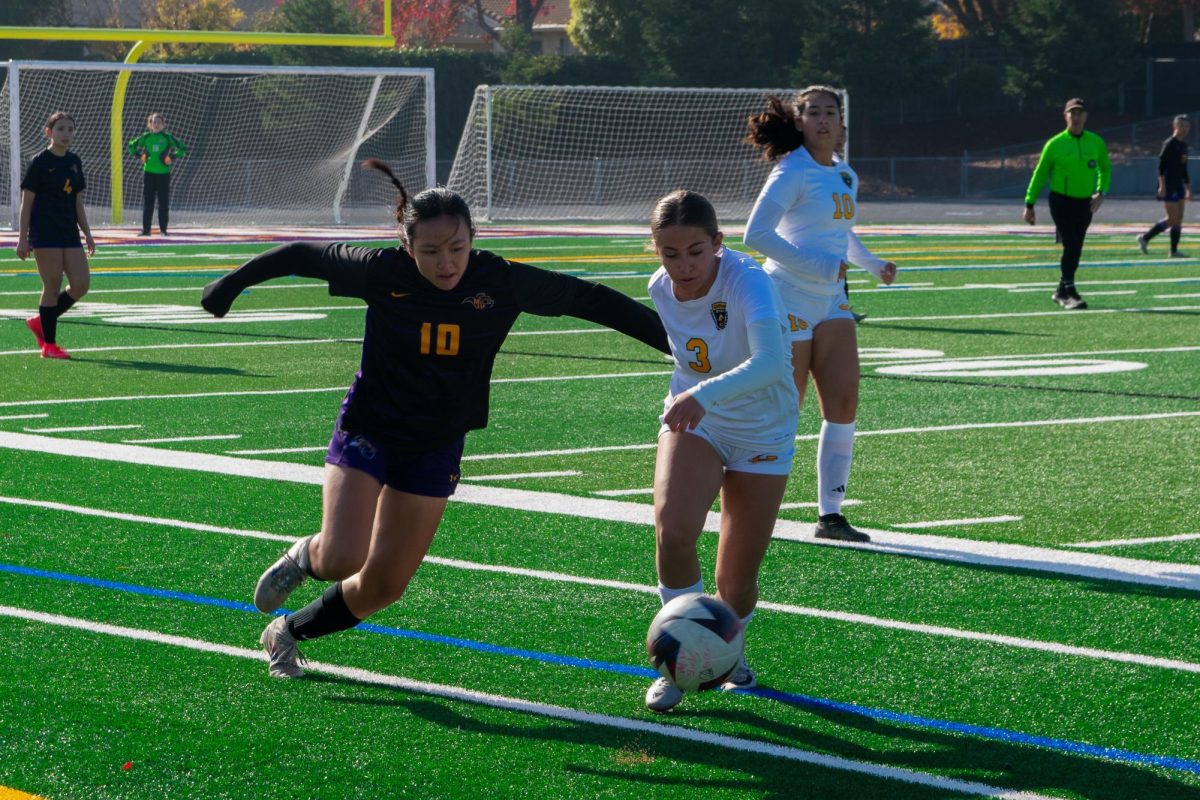 Senior Sophia Yamada attempts to steal the ball from the opposing team. Photo | Sania Nadkarni