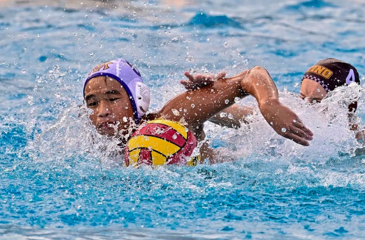 Sophomore Trevor Yuen swims towards the ball during a Water Polo match. Photo courtesy of Trevor Yuen | Used with permission