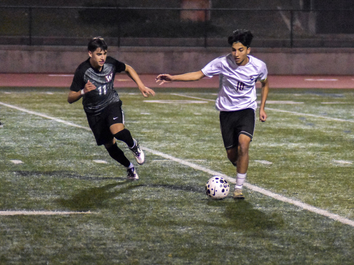 Senior captain and midfielder Bhanu Raut outruns WHS’ defense, taking the ball up the field in hopes of scoring. Photo | Suryansh Gupta