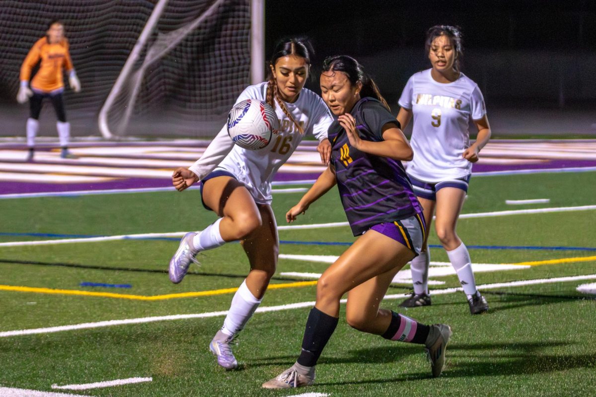 Senior and striker Sophia Yamada runs to the ball, hoping to intercept it. Photo | Liz Liu