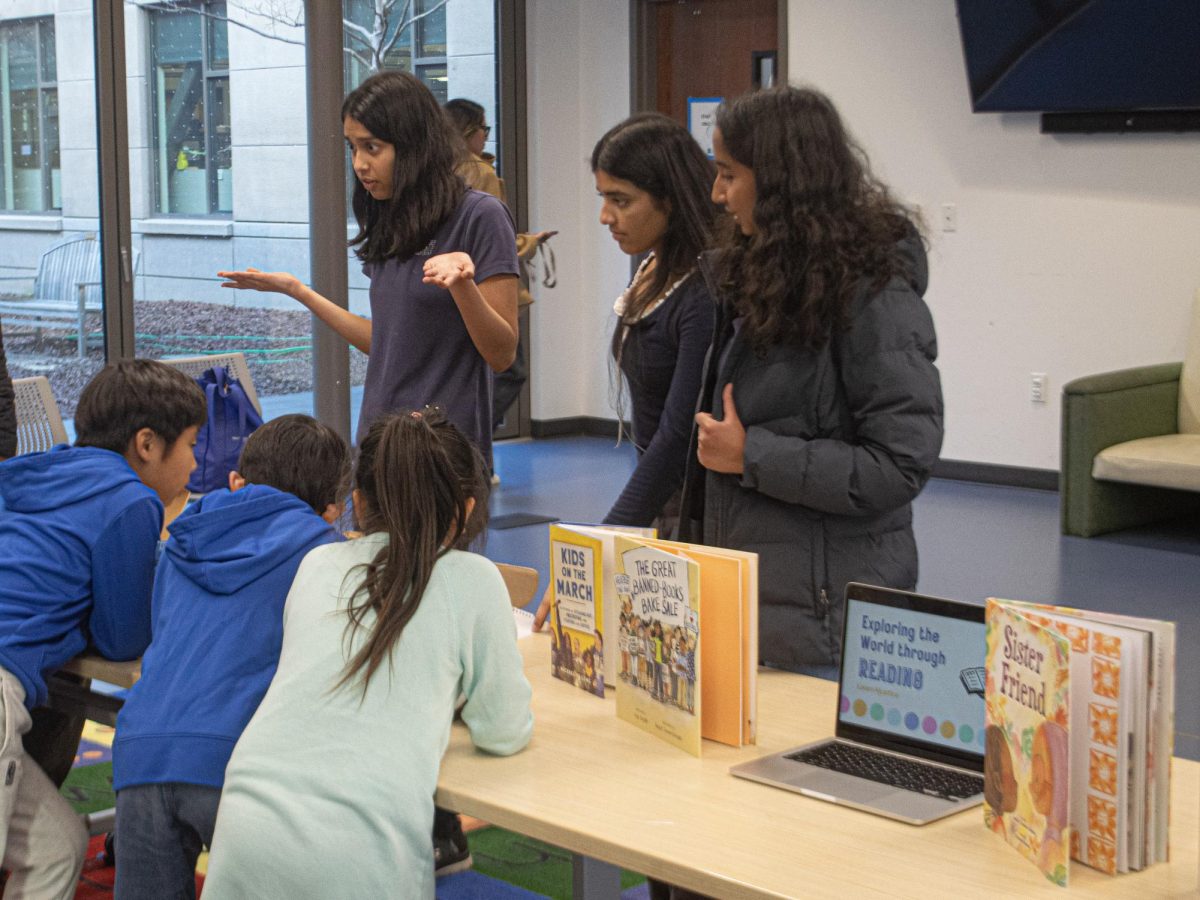 Learn4Justice Co-Executive Directors Richa Prassana and Akshadha Babu alongside Director of Events Kanika Rawat explain how to build the kits to young children. Photo | Kai Tsuchida
