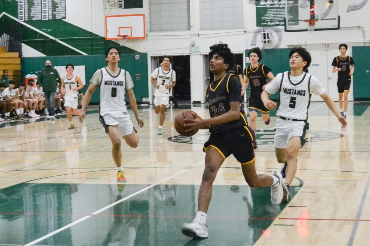 Junior, shooting guard, wing and point guard Adarsh Inampudi prepares for a layup. Photo | Corinna Kuo
