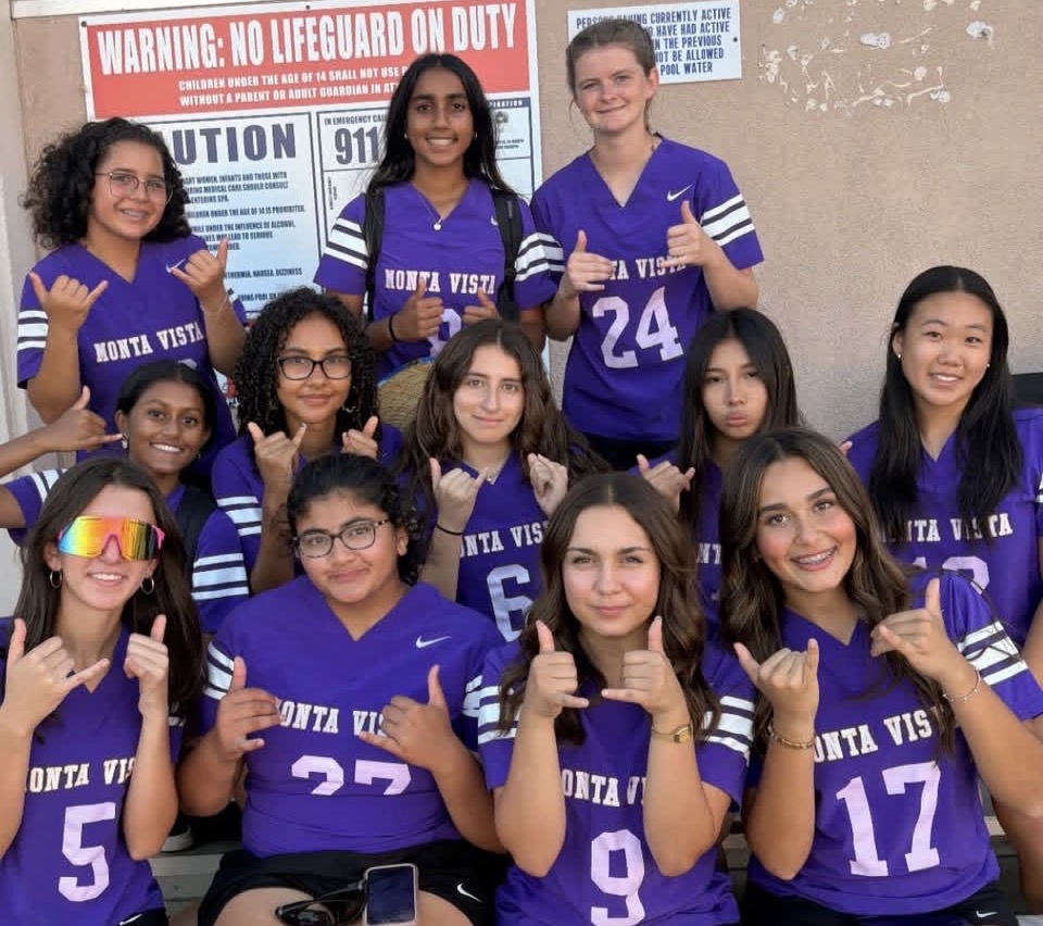 The Girls Flag Football team poses for a photo while supporting the Boys Water polo team. Photo courtesy of Allie Rummelhoff