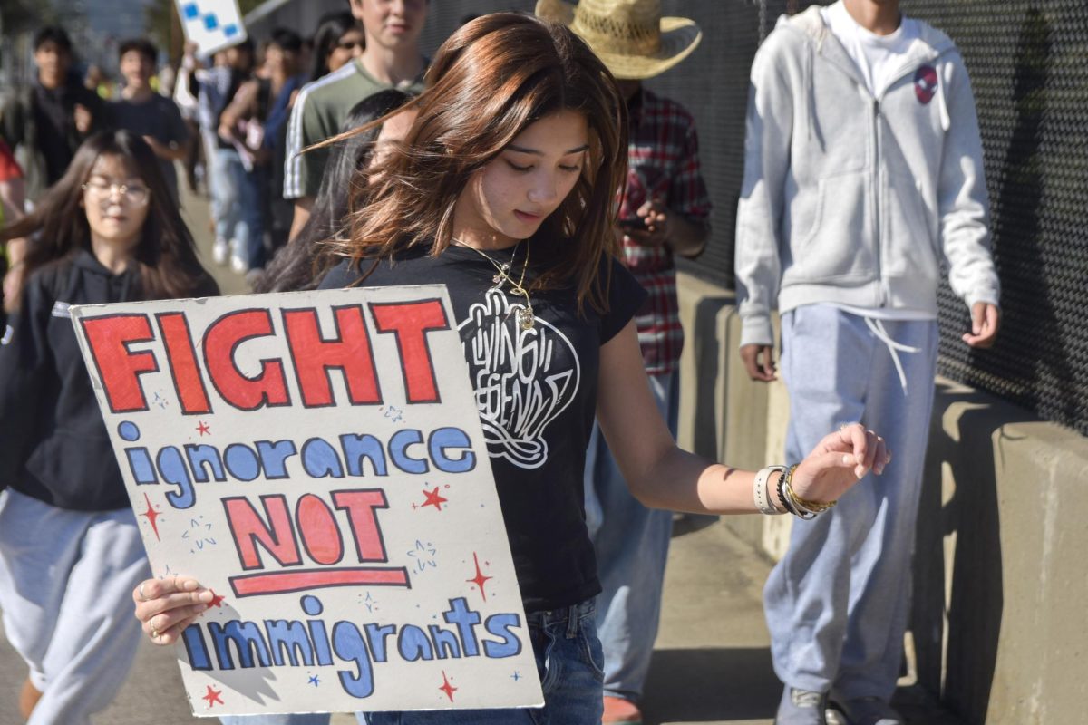 Students held up handmade signs and repeated chants during the march to Cupertino City Hall
