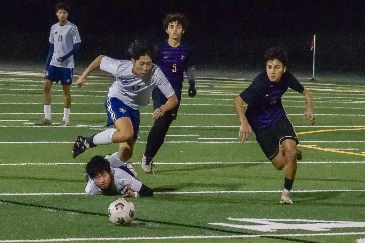 Senior captain and midfielder Bhanu Raut sprints down the field with an LHS defender. Photo | Leo Lee