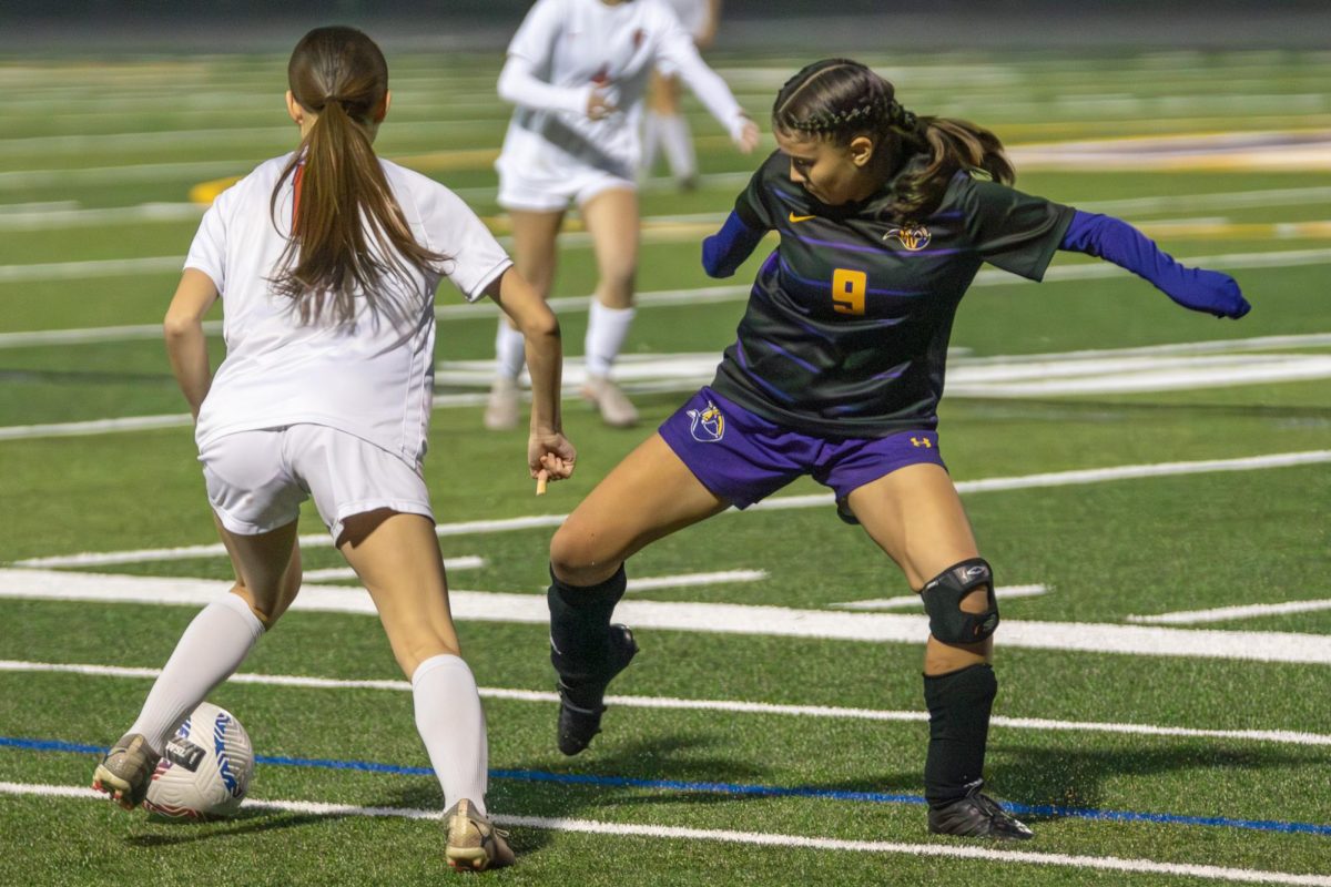 Freshman and outside back Lily Frefel intercepts an SHS player. Photo | Elizabeth Yang