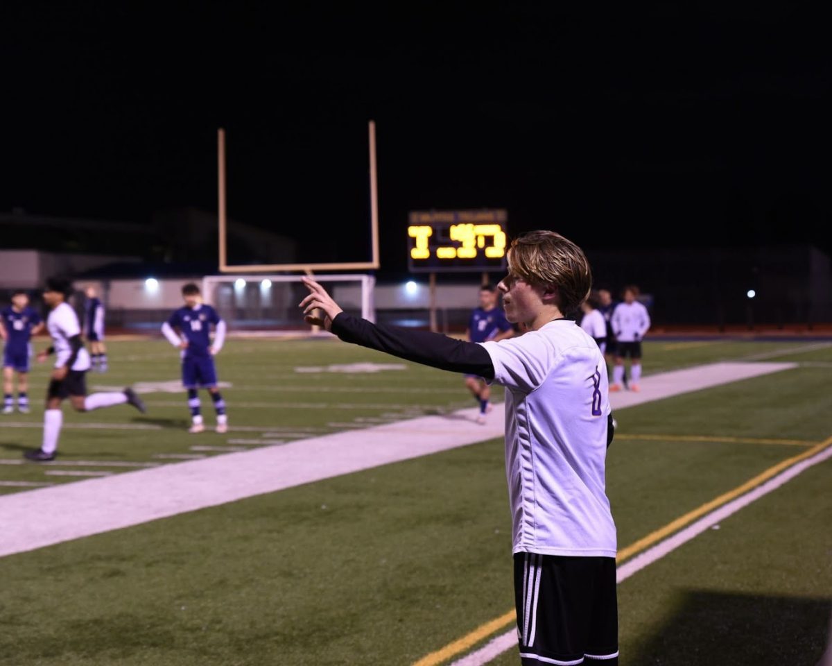 Sophomore and center back Dante Gallo directs teammates positioning before a throw-in. Photo | Divina Pandita-Raina 