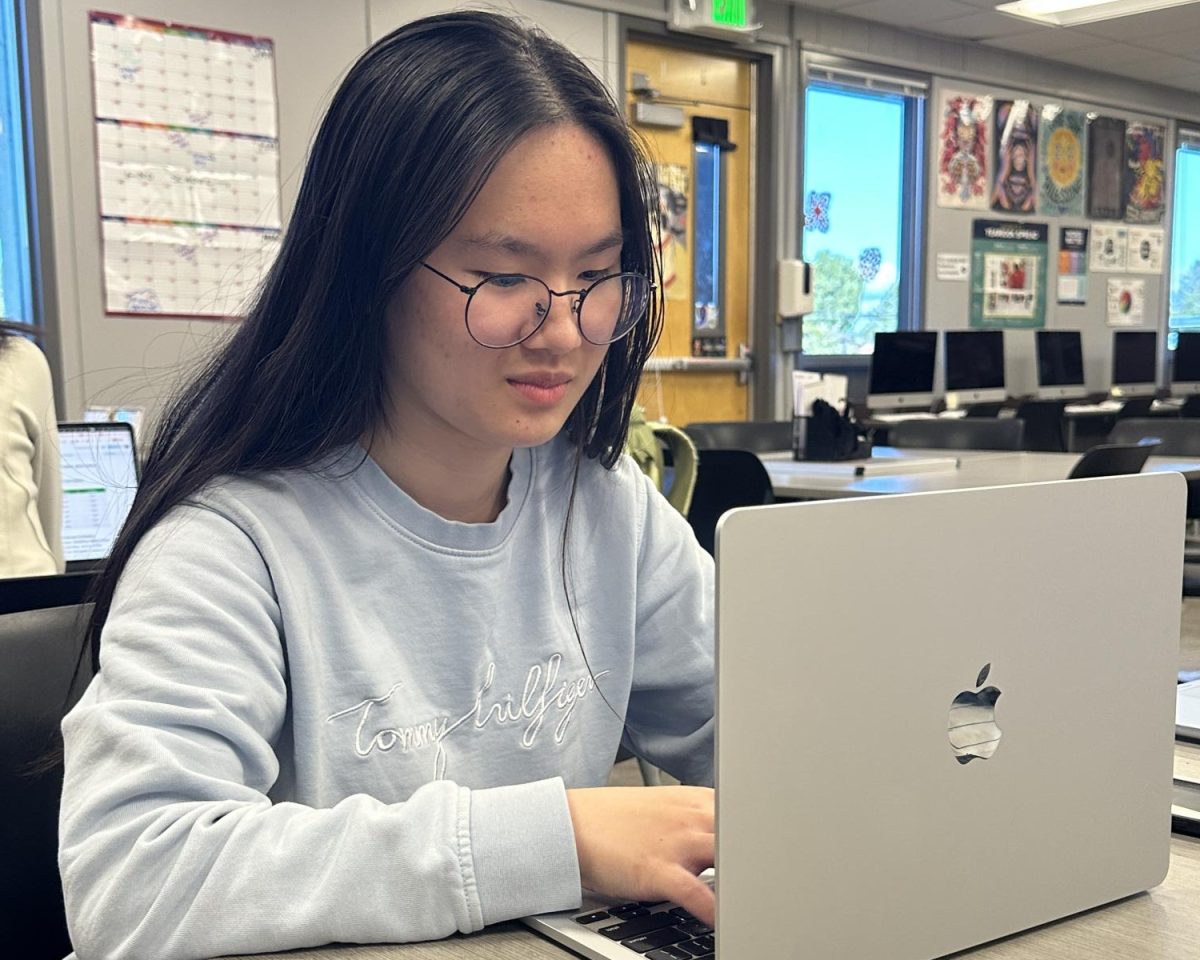 Junior Erin Liu works on her computer. Photo | Angela Poon
