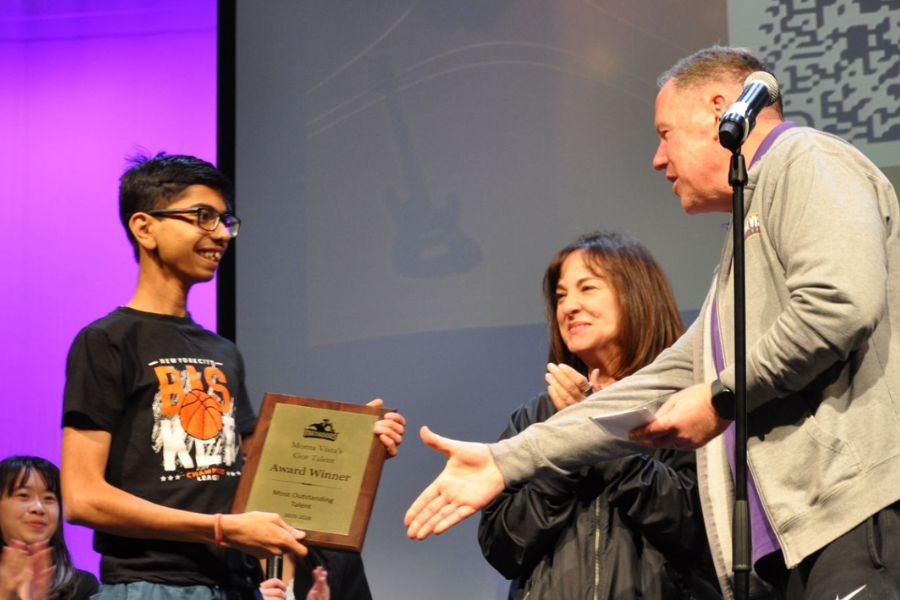 Sophomore Janmejay Khandelwal receives his first place plaque. Photo | Kate Yang