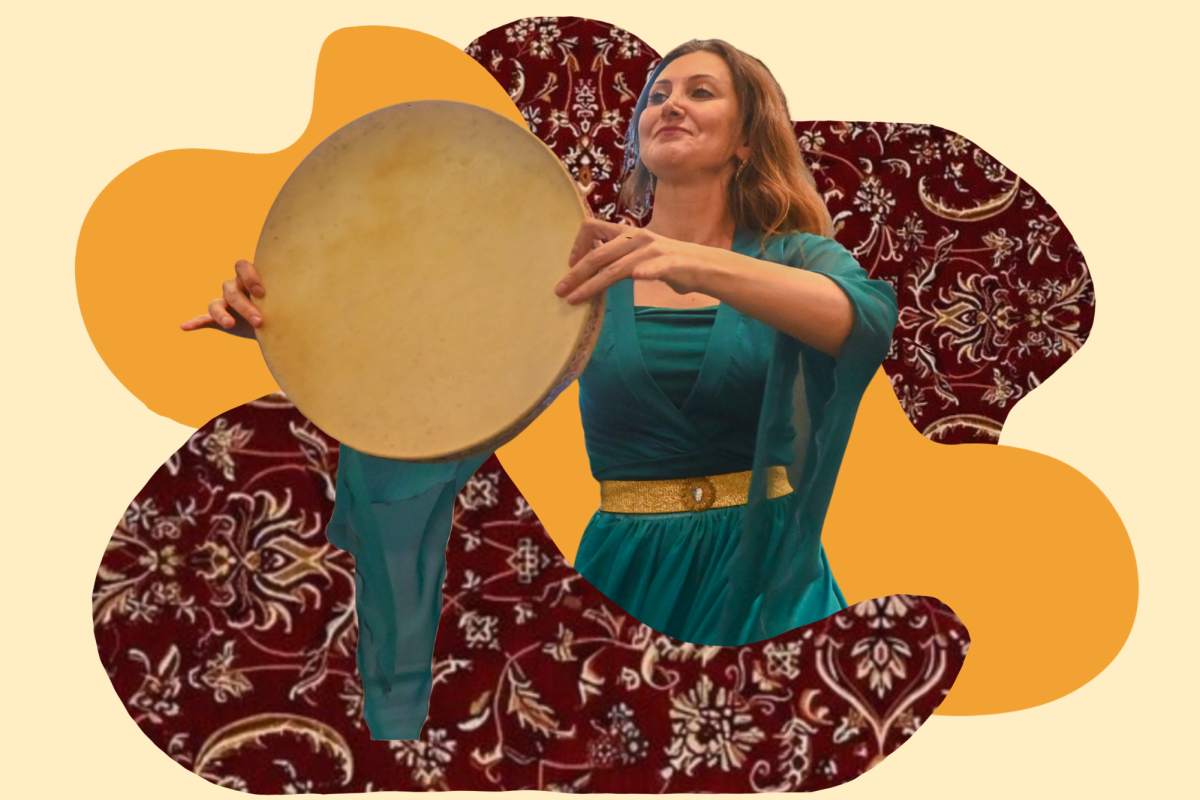 Berenji showcases a drum dance to audience members. She explains that the beating of the drum symbolizes a heartbeat. Photo | Meghna Dixit