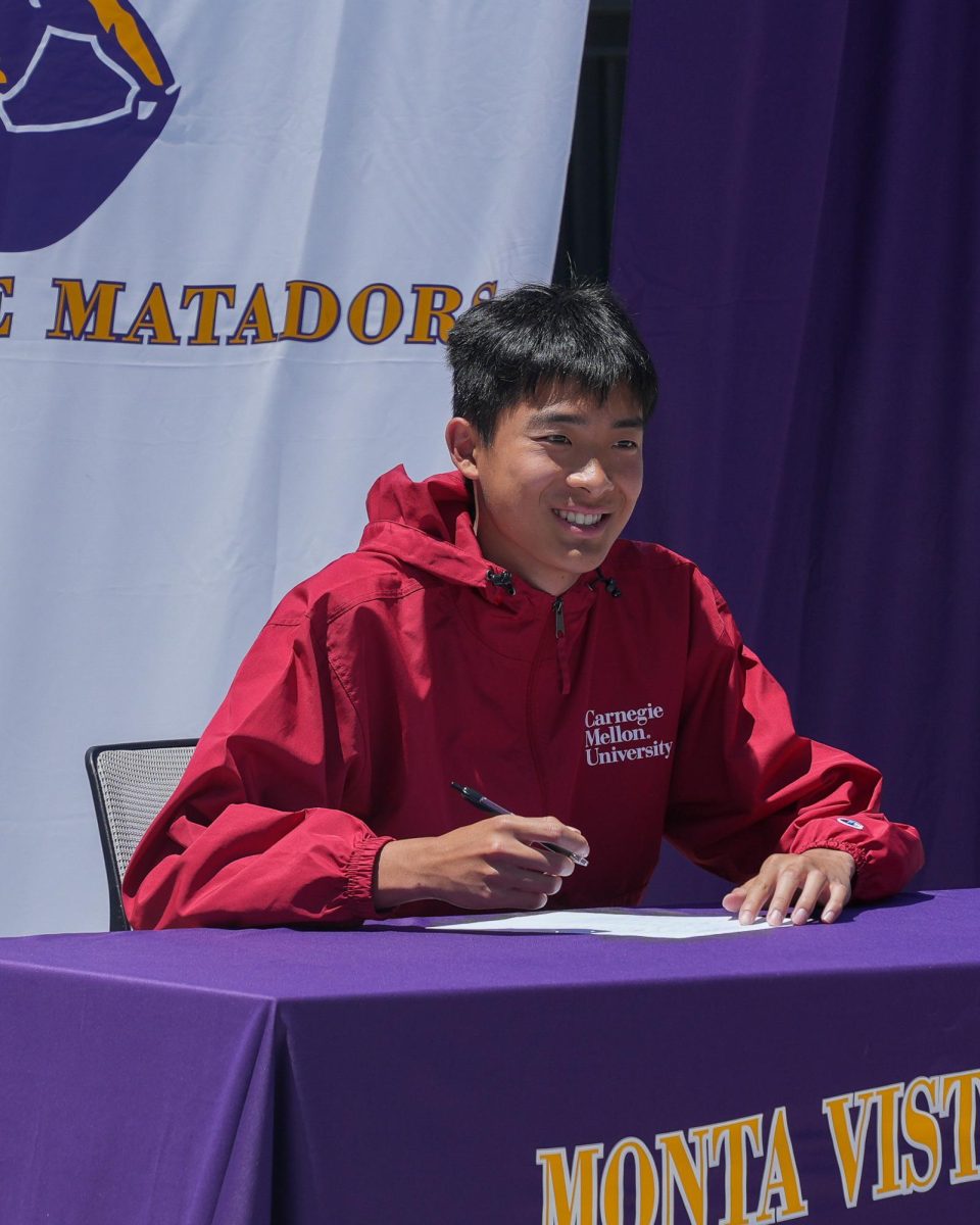Senior Ryan Shen signs his commitment to Carnegie Mellon University for track and field. Photo by Maahi Dev
