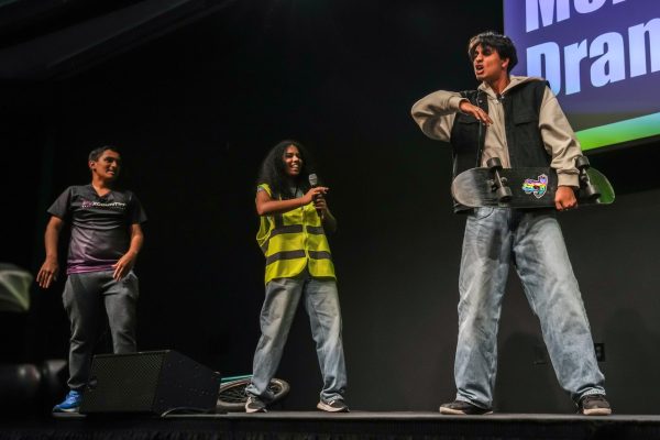 Senior Sayuj Masurkar passionately argues in favor of eco-friendly transit, such as biking and skateboarding to school during MVHS drama’s showcase. Photo | Juju Ling