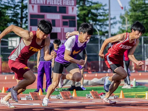Senior and sprinter Jayden Tang runs off the starting block. Photo courtesy of Jayden Tang | Used with permission