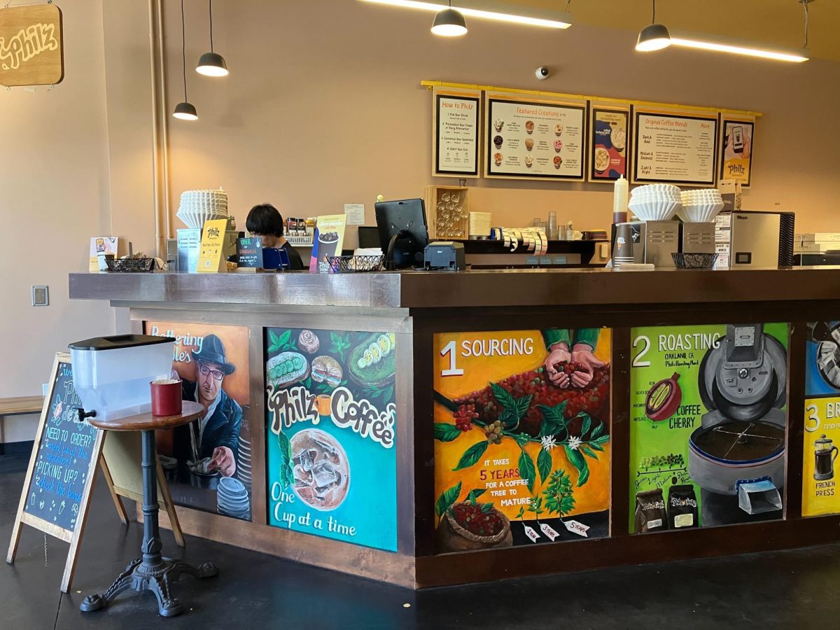Branded artwork and menu displays reflect the store's emphasis on coffee culture and community. | Photo by Sophia D'sa 