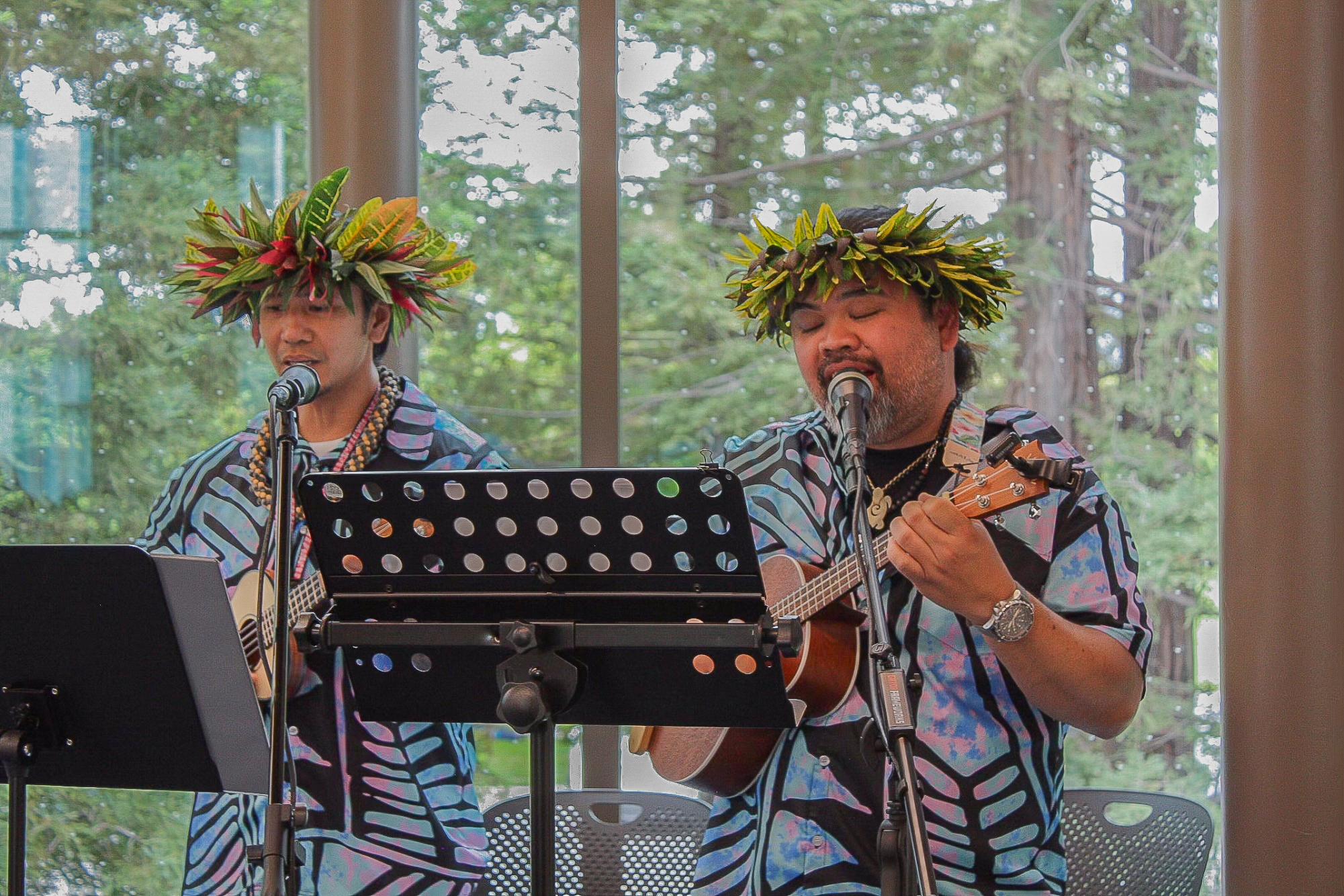 Two musicians strum ukuleles while singing the song during the performance. Multiple singers, including Aranda, played instruments while singing. Photo | Sana Karkhanis