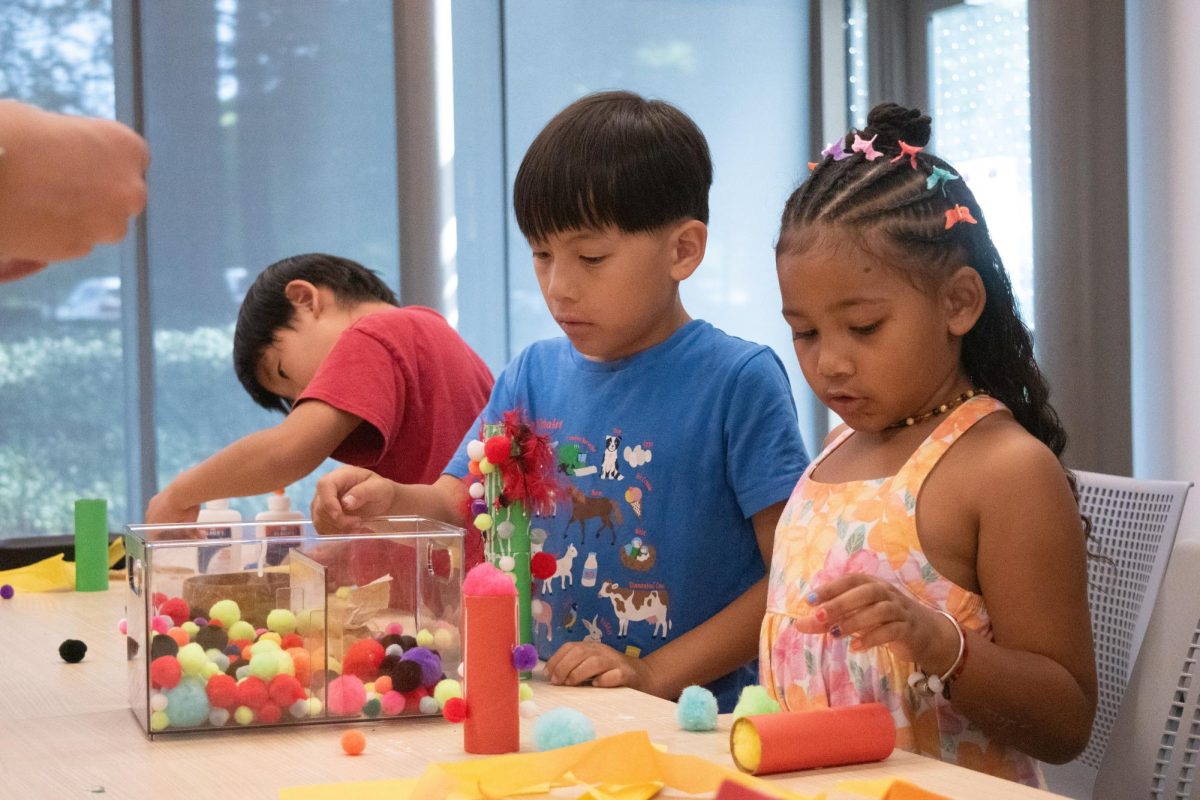 Children decorate their dragons with pom-pom balls. Photo | Jonah Chang